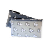 These two Miffy zippered pouches feature a charming Japanese design with cartoon rabbits, reminiscent of the classic Miffy Bunny print. Available in sleek black and elegant gray, they add whimsy to your essentials. Product: Miffy Bunny Print Case - Black 19cm.