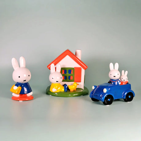Miffy Schoolbag Ceramic Figurine with bunny in blue outfit holding bag, near house and car with bunnies by Miffy