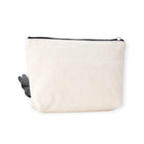 Off-white canvas zipper pouch with black zipper and ghost character patch