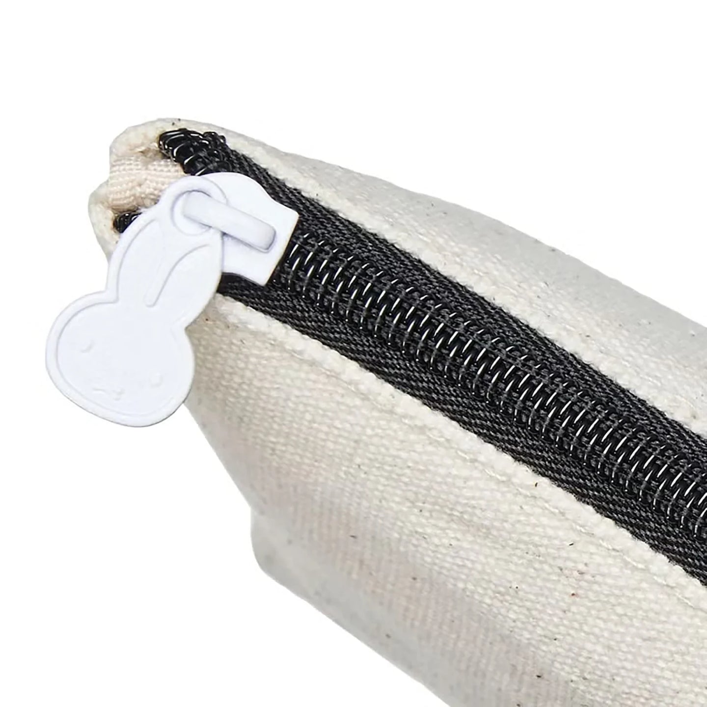 Off-white canvas pouch with black zipper track and ghost keychain detail