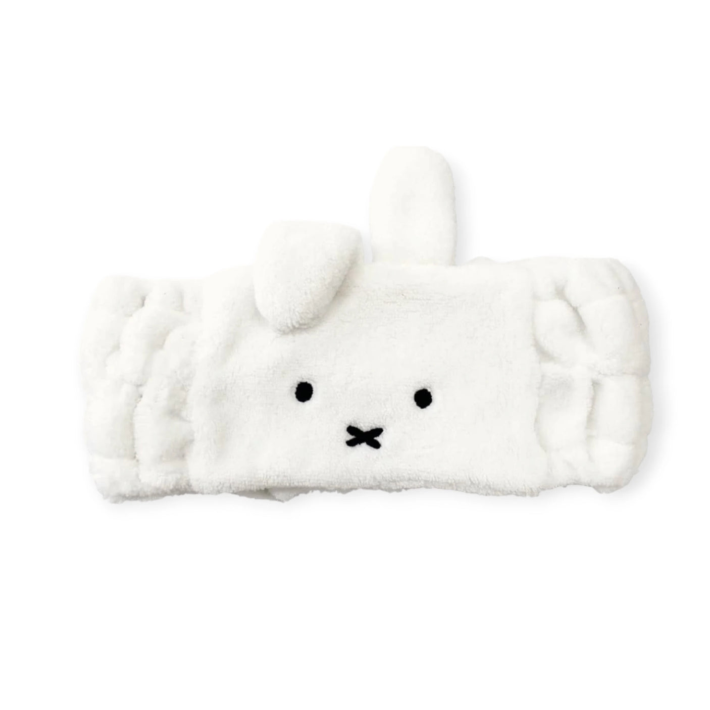 Enhance your skincare routine with the plush Miffy Bunny - Spa Headband by Miffy, featuring a cute bunny face and ears. It's perfect for keeping hair in place while adding fun to your daily regimen.