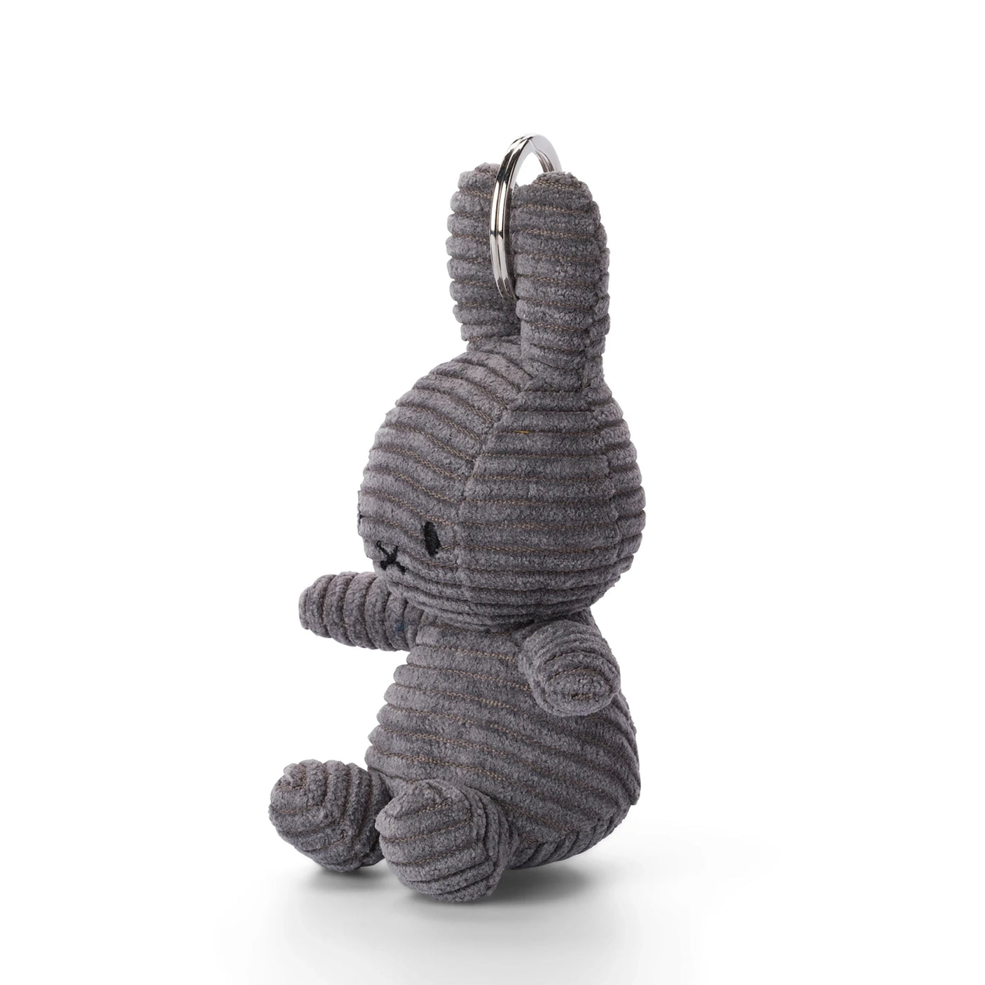 The Miffy Keychain Corduroy 10cm in Charcoal by Miffy features a charming seated plush, gray bunny with a ribbed, corduroy-like texture on a plain white background.