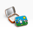 Open Miffy pill tin with silver lid and white round pills; blue-green Dutch artwork