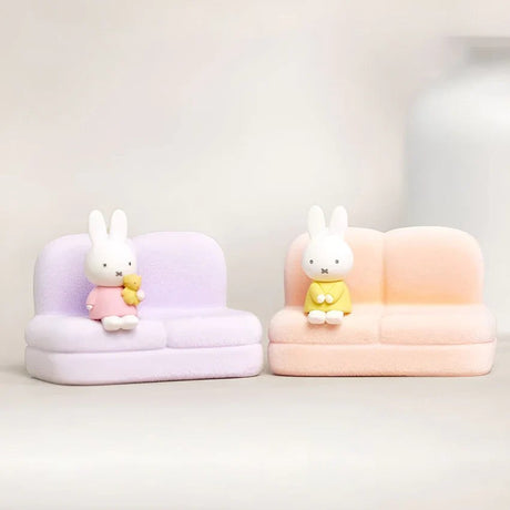 Miffy sofa phone stands with bunny figures on lavender and peach seats
