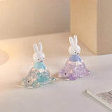 Rabbit blind box figures in blue and purple translucent cone outfits