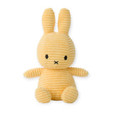 A Miffy Bunny Plush Corduroy in Buttercream, measuring 23 cm, featuring a ribbed texture with long ears and a small black face, is shown sitting upright against a white background and providing hypoallergenic comfort.