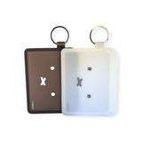 The Miffy Bunny Card Case collection includes two silicone keychain holders in brown and white, each with minimalist face designs and sturdy metal rings. These semi-transparent cases add a playful touch to your essentials against a pristine white background.