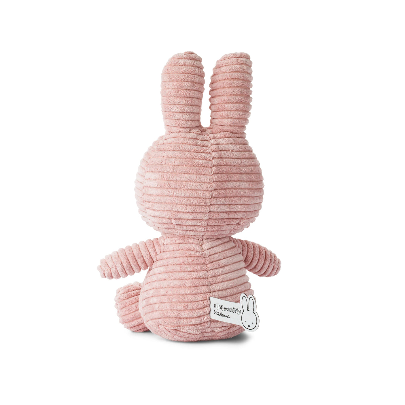 This pink 23cm Miffy Bunny Plush Corduroy by Miffy, featuring a baby-safe design, sits adorably with its long ears and back to the viewer, embodying all the charm of a corduroy bunny.