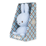 The Miffy Quilted Plush Gift Box - Blue 23cm, by the brand Miffy, features a charming quilted plush in a calming light blue, nestled within an elegant Ice Blue Gift Box decorated with a diamond pattern. The eco-friendly box highlights its use of 100% recycled filling, making it a considerate and sustainable option for any occasion.