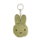 The Miffy Plush Flat Keychain - Corduroy is an eco-friendly, green bunny-shaped keychain designed with ribbed corduroy and features a metal ring and chain.