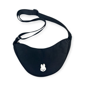 Black crescent crossbody bag with adjustable strap and white bunny logo