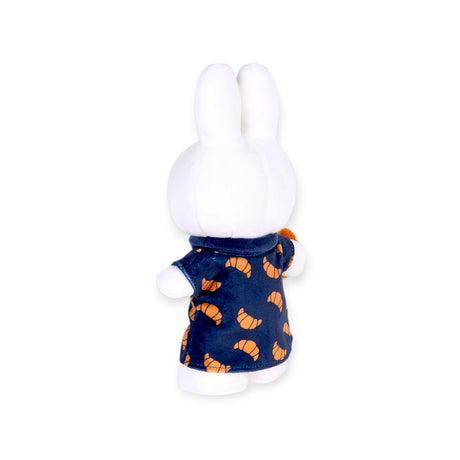 Rear view of Miffy plush wearing navy dress with orange croissant prints, gallery position 1