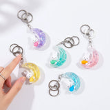 Rabbit moon keychain charms in pastel colors with silver rings, multiple styles shown