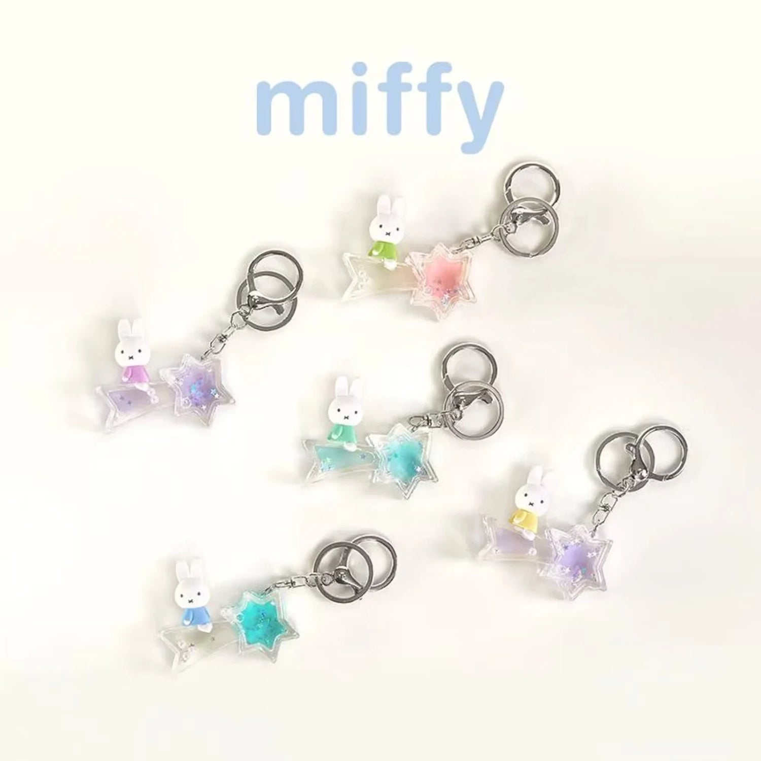 Collection of rabbit moon and star keychains with pastel charms and silver key rings