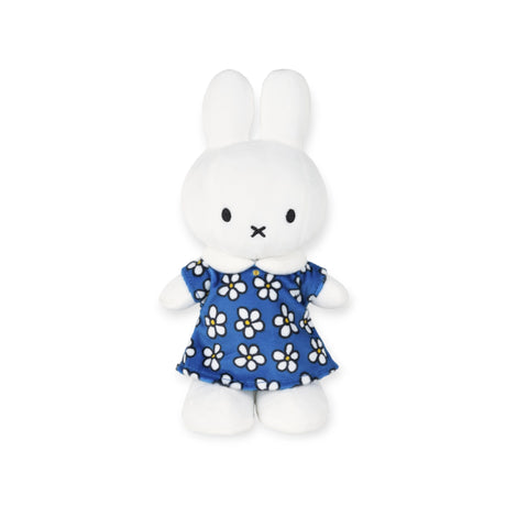 Celebrate in style with the limited edition Miffy Flower Dress Plush 23cm—a plush white rabbit toy dressed in a charming blue dress adorned with white flowers, perfect for the special 70th year celebration.