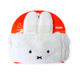 The Miffy Bunny Spa Headband by Miffy is a plush white accessory with cute bunny ears and a sweet face on an orange circular backing with Japanese text, ideal for adding charm to your skincare routine.