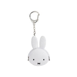 This Miffy Keychain Coin Pouch by Miffy is a white silicone pouch shaped like a bunny with a simple face and long ears, reminiscent of the beloved Japanese character.