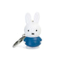 Adorable and charming, the Miffy Keychain - Classic by Miffy features a white rabbit figurine dressed in a blue outfit with minimalistic black eyes and mouth, highlighting its timeless design.