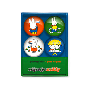 Set of four colorful Miffy glass fridge magnets in blue and green packaging, front view, gallery image one