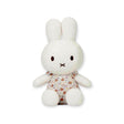 A Miffy Plush White & Vintage Flowers toy, featuring a white rabbit with long ears in a beautiful Vintage Flower Dress, is positioned upright against a plain background.