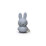 This stylish powder-colored Miffy Keychain from the Miffy brand showcases a minimalist design that captures the essence of the beloved Miffy Bunny. Featuring small black eyes and a cross for a mouth, it offers a modern twist on a classic look.