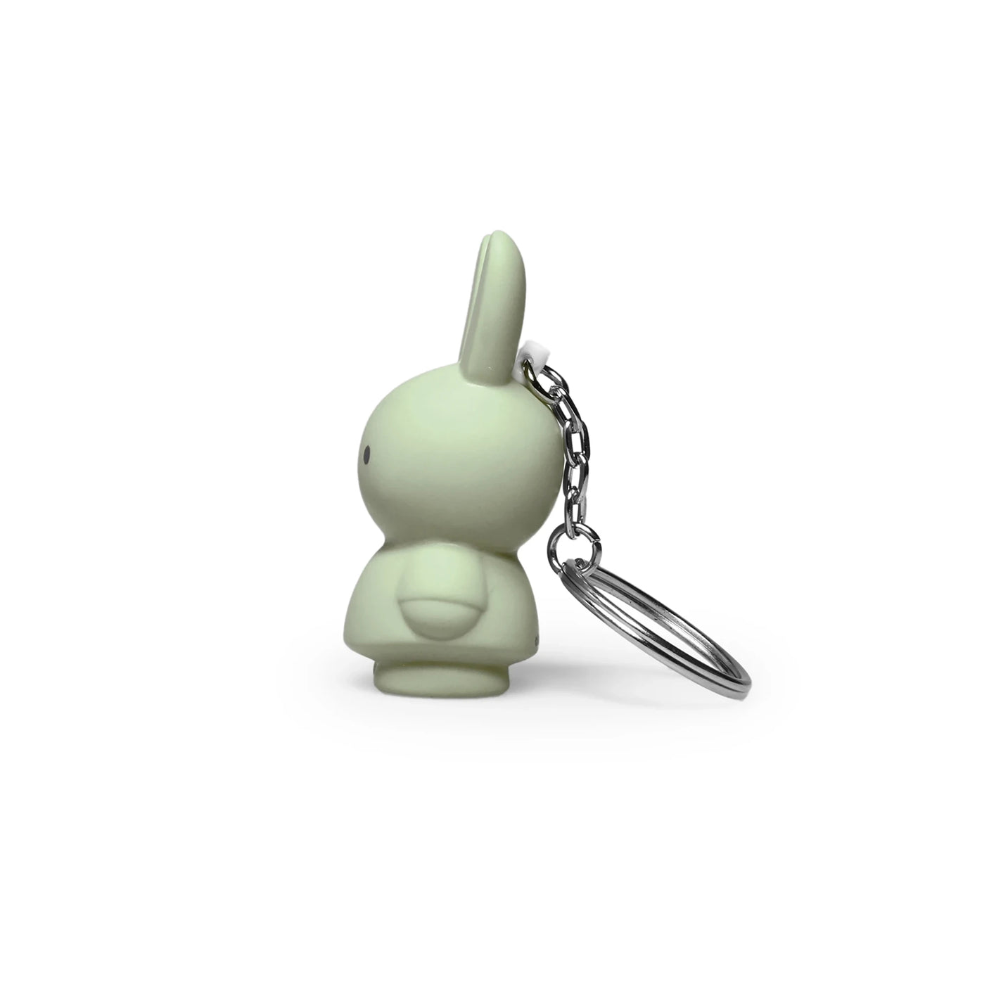 Side view of the Miffy Keychain in powder color, showcasing a charming bunny shape with a modern twist. It features a minimalist design and comes with an attached metal ring.