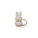 The Miffy Keychain - Powder by the brand Miffy features a minimalist design with a beige cartoon rabbit character, adorned with long ears and a simple expression, all set against a plain white background.