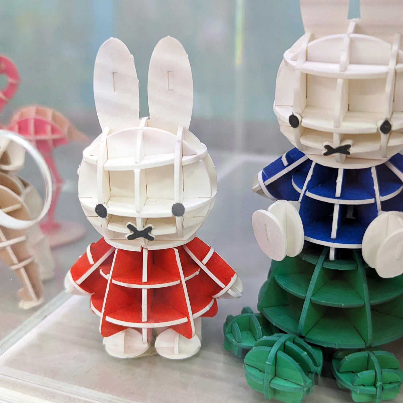 Miffy 3D paper puzzle figure in red dress, eco-friendly and tool-free craft from SI-GU-MI series displayed on shelf.