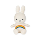 The Miffy Rainbow Plush - 18cm by Miffy features a white bunny with long ears, a small face, and an embroidered rainbow on its torso. Made from super-soft textured fabric, it's perfect for snuggles.