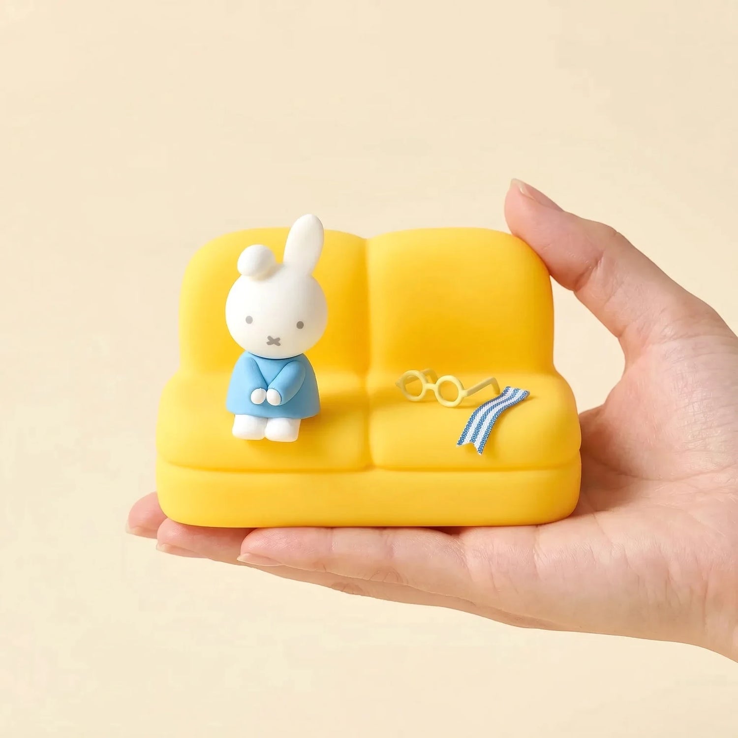 Yellow mini sofa stand with Miffy figure and small accessory details