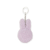 The Miffy Keychain Tiny Teddy Plush - Terry is an eco-friendly, purple keychain featuring adorable bunny ears and a silver chain with a ring, ideal for adding charm to your accessories.