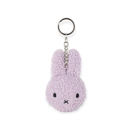 The Miffy Keychain Tiny Teddy Plush - Terry is a purple, eco-friendly keychain featuring a simple embroidered face and metal ring to keep your keys secure, offering charm and utility in one.