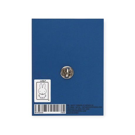 Back view of Miffy Thinking Enamel Pin secured on blue backing card with printed label and barcode