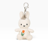 Cream plush rabbit keychain with metal clasp, orange tulip stitched on chest