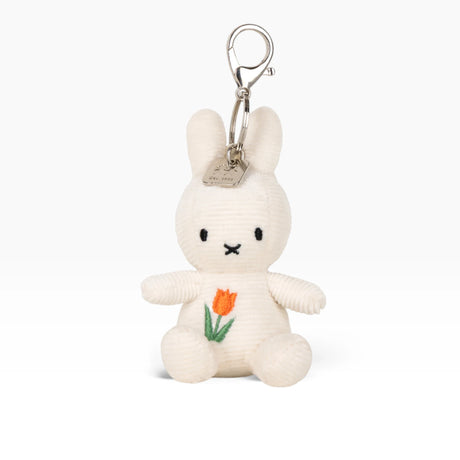 Cream plush rabbit keychain with metal clasp, orange tulip stitched on chest