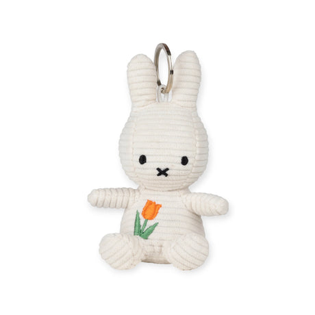 Introducing the Miffy Plush Tulip Keychain - 10cm by Miffy, a whimsical and sustainable accessory featuring a plush bunny with a simple face and charming tulip, perfect for personalized touches.