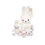 Assorted white corduroy bunny keychains with metal rings and small fabric tags