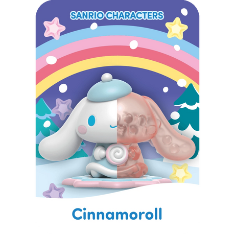 A Cinnamoroll figure from Mighty Jaxx's Sanrio Snowy Dreams Blind Box features a snowy landscape with a rainbow and stars.