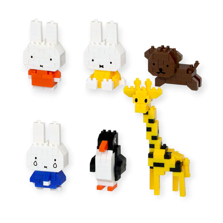 Six Nanoblock mini figures from Miffy Blind Bag Vol. 2 including rabbit, penguin, giraffe, and dog on white background