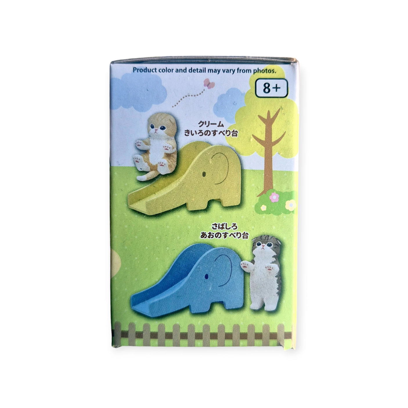 Mofusand Blind Box - Cats on Slides comes in toy packaging showcasing mini cat figures sliding on elephant-shaped slides, plus a plush bear and dog in a grassy park setting. Suitable for ages 8 and up.