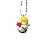 Bumblebee cat keychain charm holding a red strawberry with silver chain