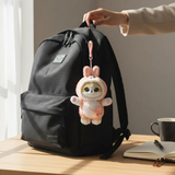 Mofusand Bunny Mini Bag - Plush Keychain hanging from black backpack strap in soft pink bunny costume with detailed face