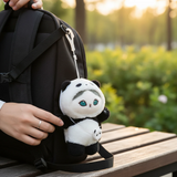 Mofusand Panda Mini Bag - Plush Keychain hanging from black backpack strap with soft panda costume design outdoors