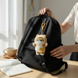 Mofusand Teddy Mini Bag - Plush Keychain hanging from black backpack, showing soft teddy costume plush with blue eyes