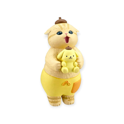 Yellow cat character blind box figurine holding a small yellow bunny