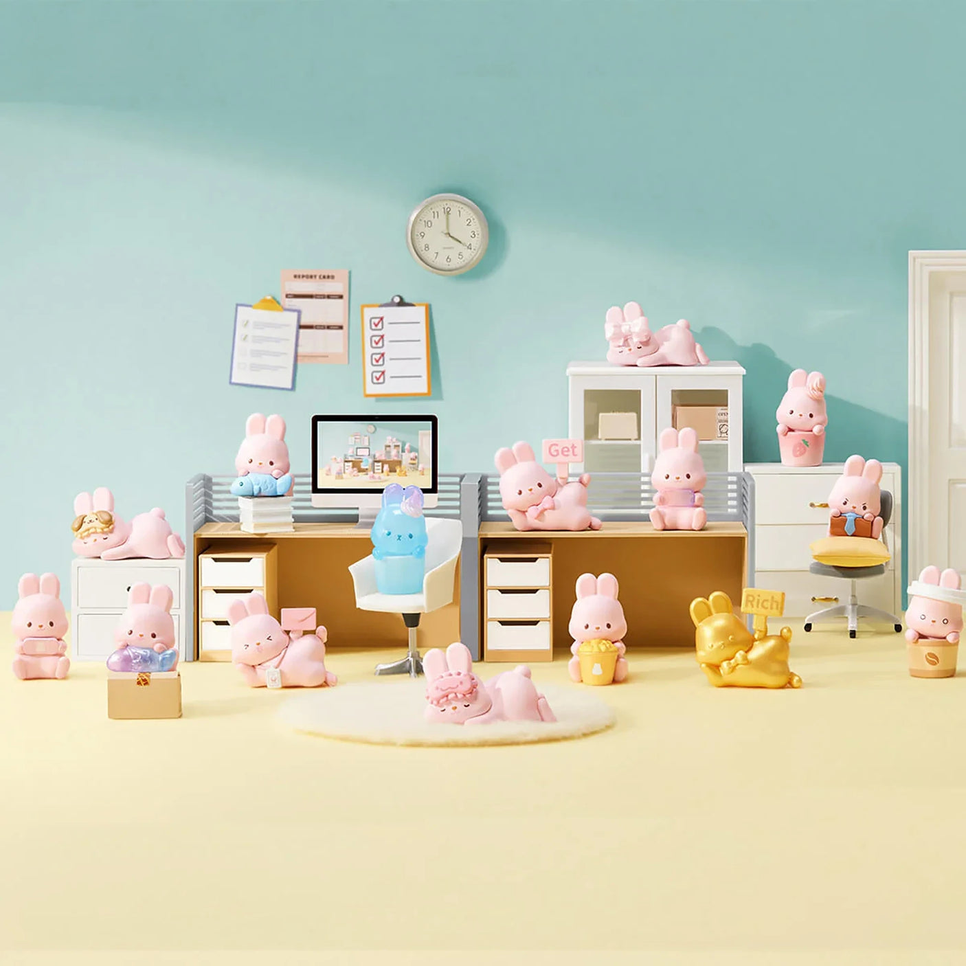 MOMO Bunny 24h Work Life Diary - Blind Box with pastel pink and gold MOMO Bunny figures in a colorful office display.