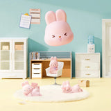 MOMO Bunny 24h Work Life Diary - Blind Box with pink bunny figures in playful poses in a miniature office setting