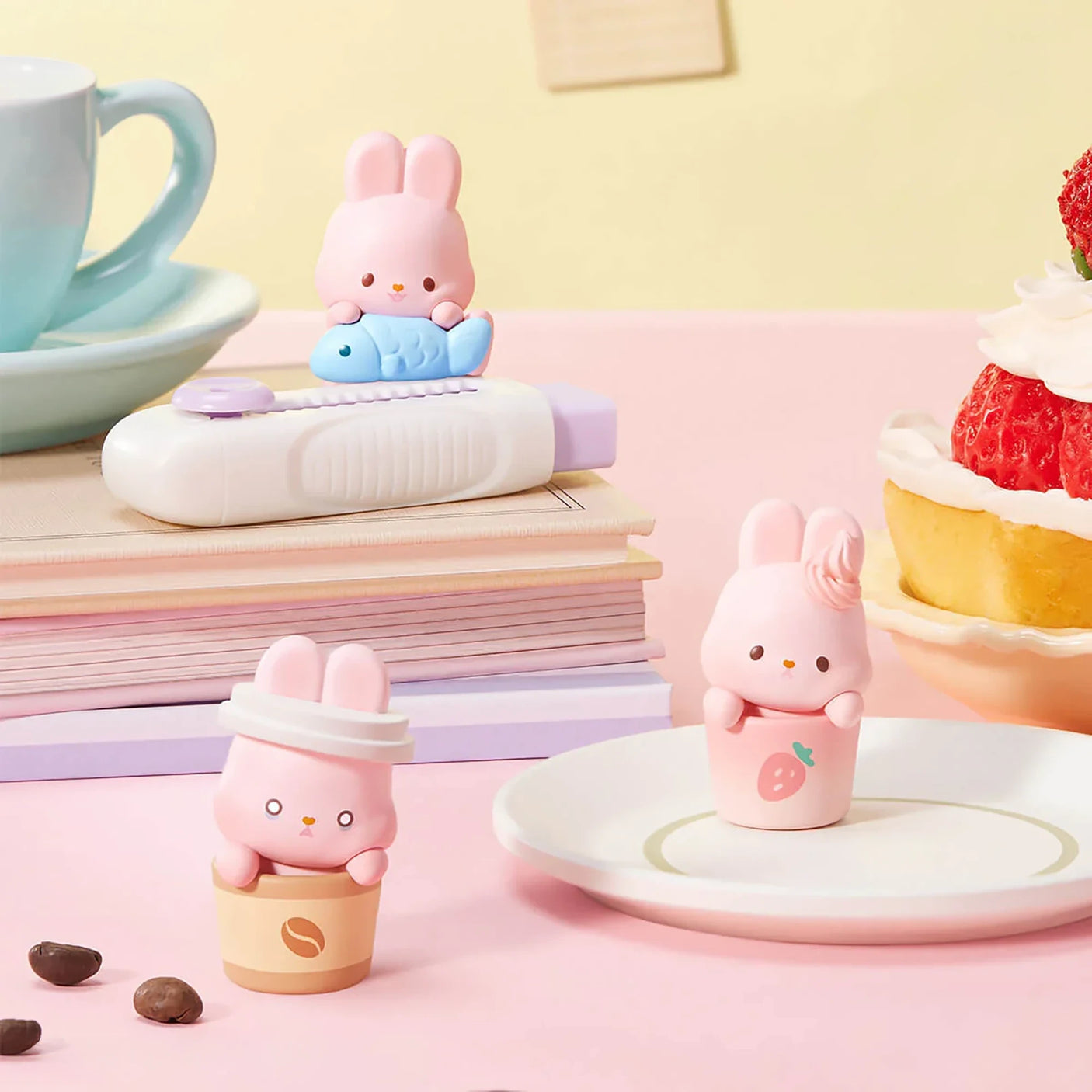 MOMO Bunny 24h Work Life Diary - Blind Box with three pastel pink bunny figures in coffee cups and holding a fish figure.
