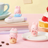 MOMO Bunny 24h Work Life Diary - Blind Box with three pastel pink bunny figures in coffee cups and holding a fish figure.