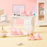 MOMO Bunny 24h Work Life Diary - Blind Box with three pastel pink MOMO Bunny figures in relaxed poses in a miniature office setting